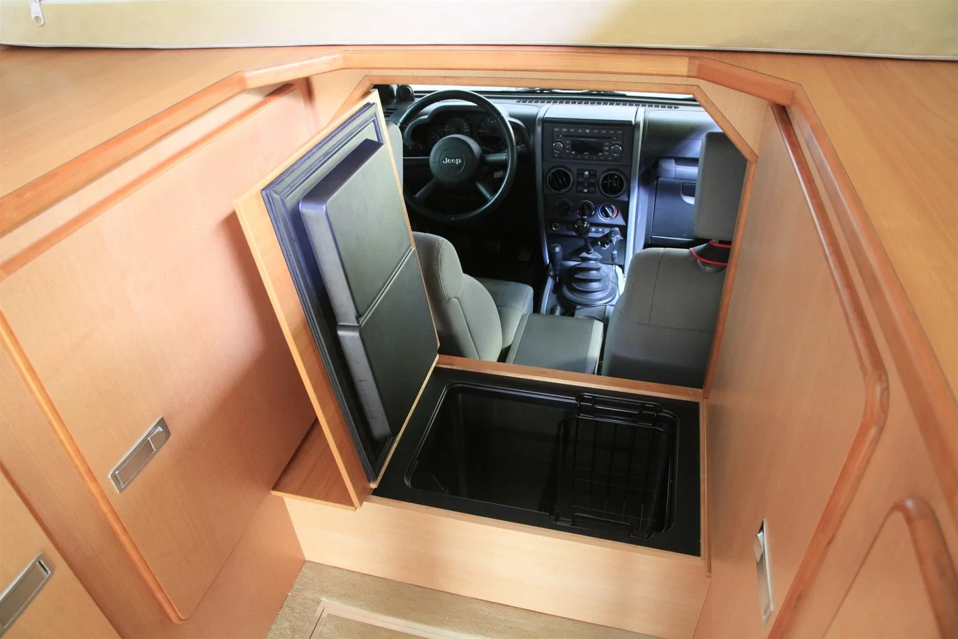 The refrigerator can be accessed from the camper and Jeep cabin