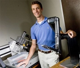 Research team member A. J. Rogers with the shrapnel-finding surgical robot