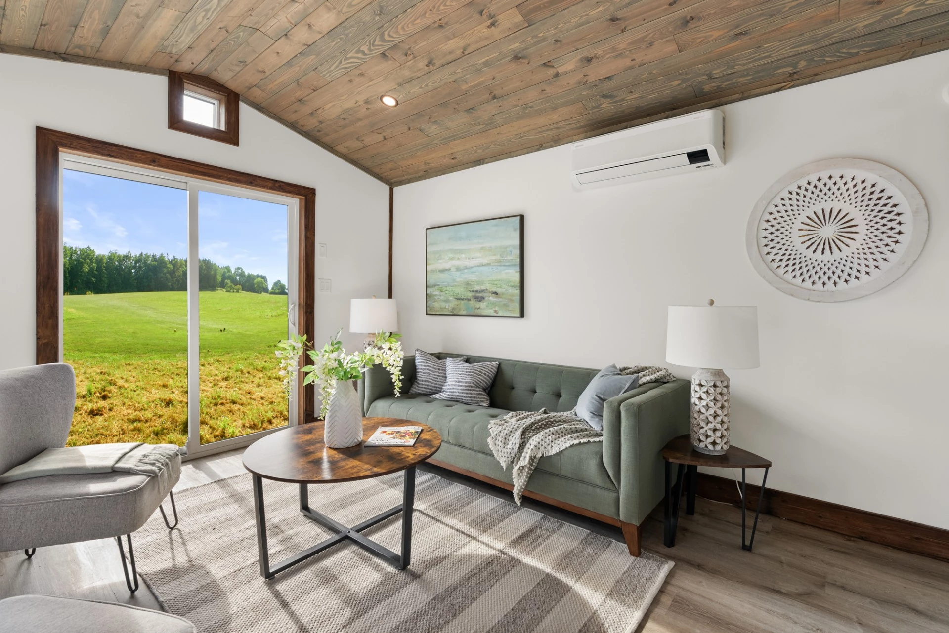 The Cypress' living room has sliding glass doors, which open it up to the outside