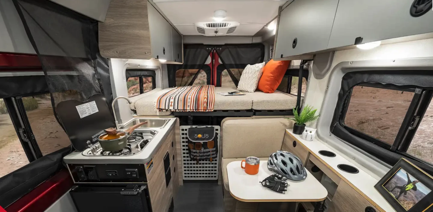 Winnebago gives the Solis Pocket a flexible floor plan with multi-position dining lounge/bed, indoor/outdoor kitchen and rear Murphy bed