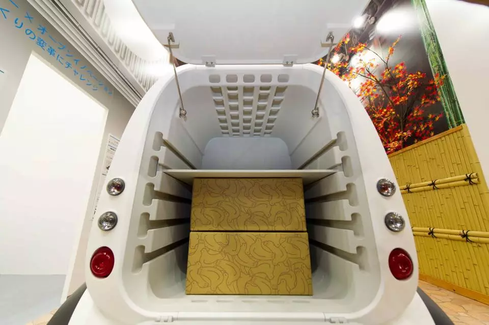 The Micro Commuter delivery vehicle has space in the rear for transporting produce