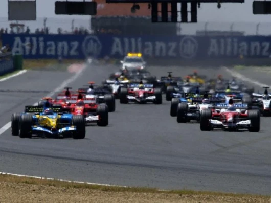 The start of the race and Alonso scoots away from Trulli. Raikkonen and Schumacher