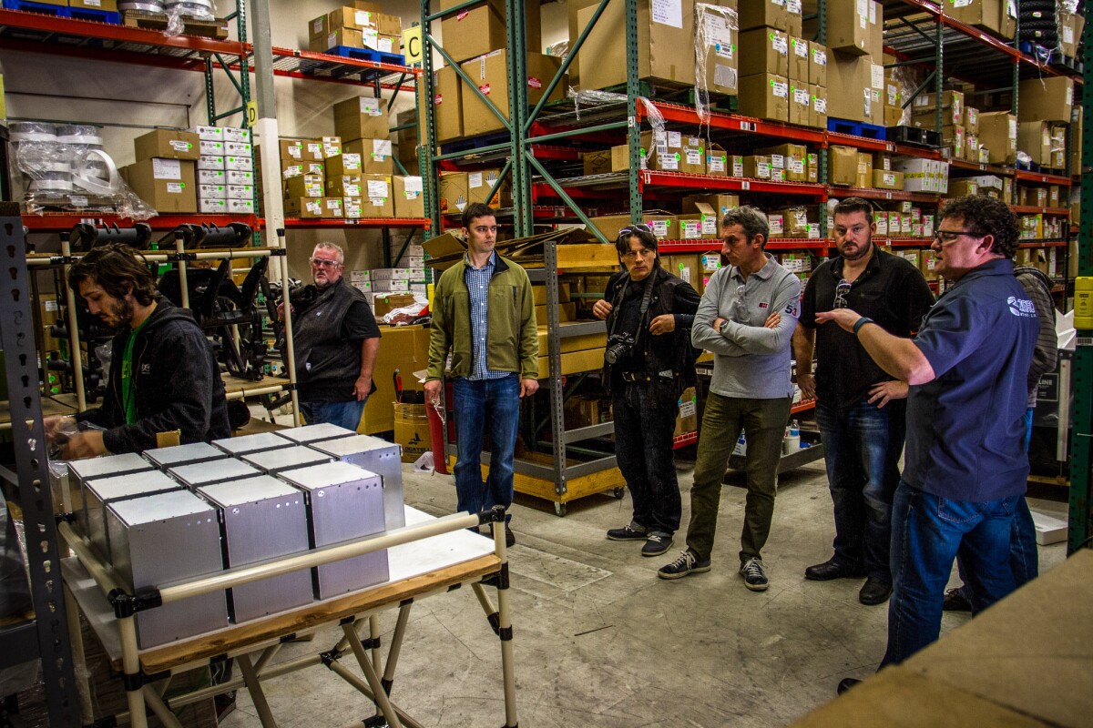 Zero's Ron Brandon leading a factory tour. On the left are the discrete battery boxes that form the monolith and modular batteries (Photo: Photo: Joe Salas/4theriders.com)