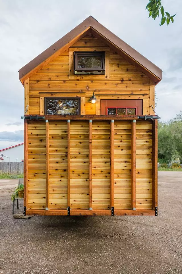 Davis's 22 ft Off-Grid Tiny Home has a drop-down deck that provides outdoor living space