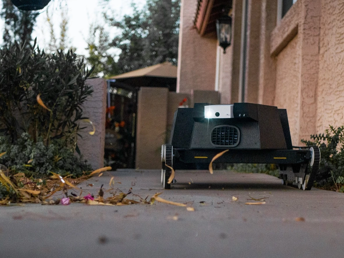 Yardroid blows leaves off of sidewalks and paths