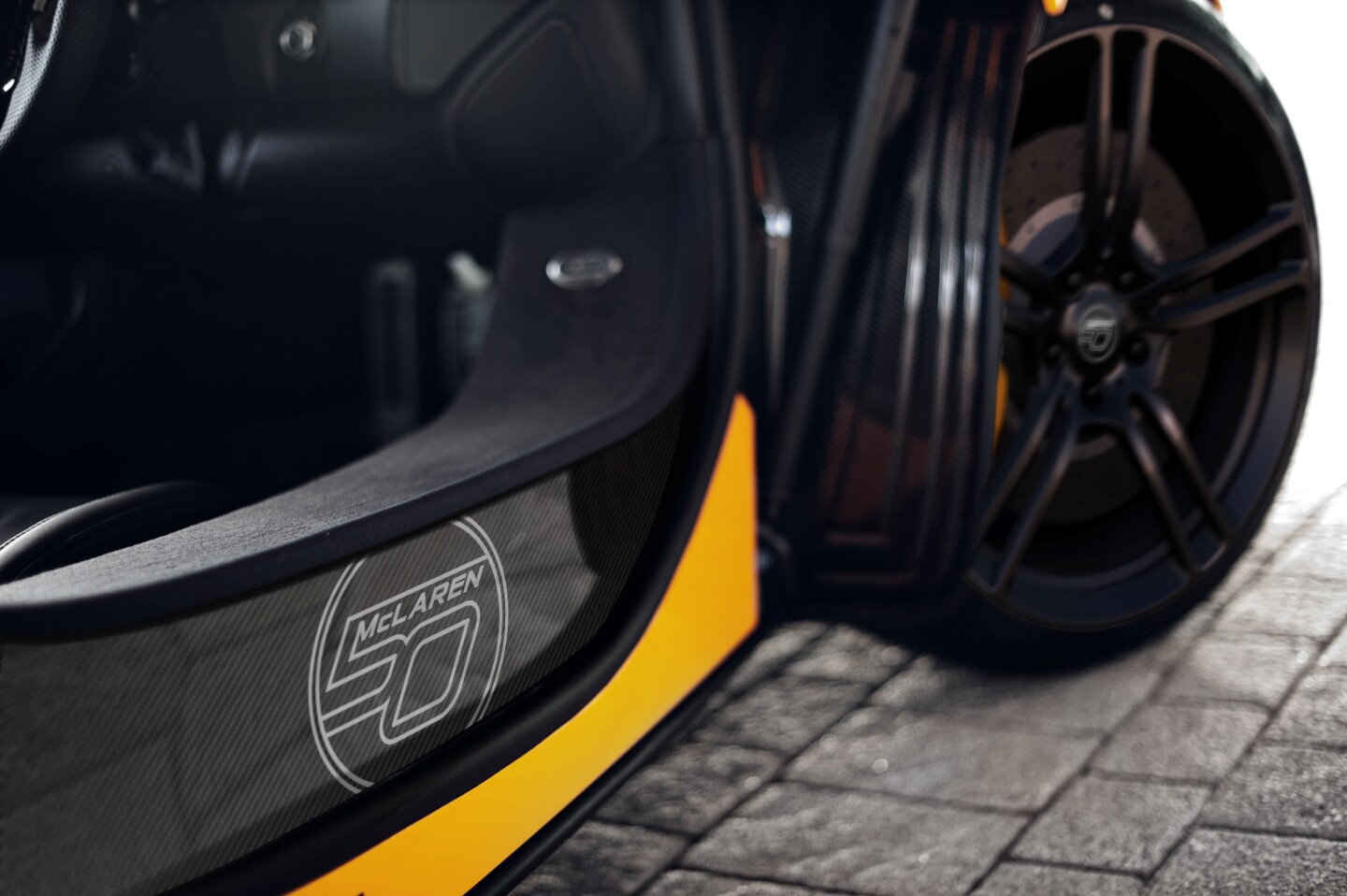 Carbon ceramic brake upgrade and satin black ultra-lightweight wheels enhance the visuals while reducing unsprung weight by 4.4 pounds