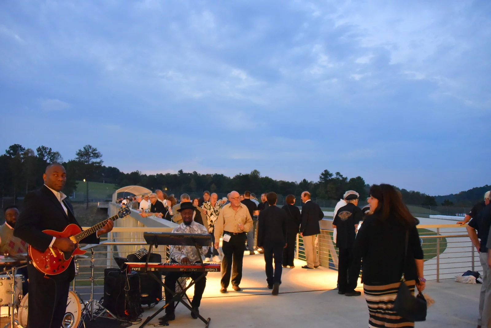 Friday night cocktail reception on the brand new "glass bridge" outside the museum over the race track