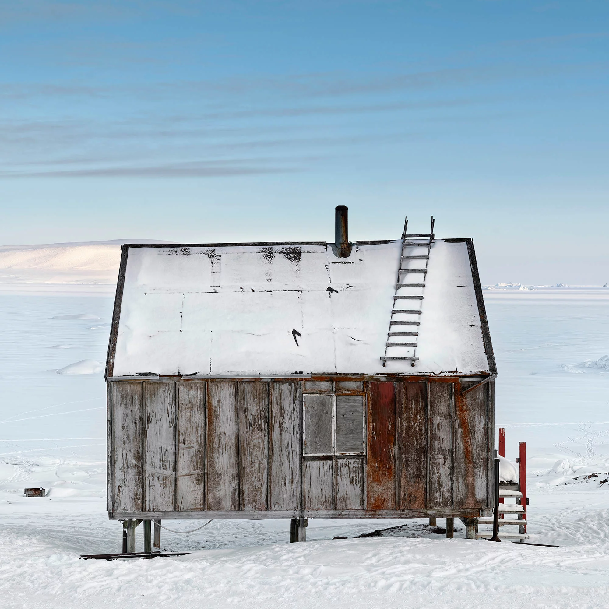 Home documents the traditional lives of Inuit hunters and their families, who live in small wooden houses in remote parts of East and North West Greenland