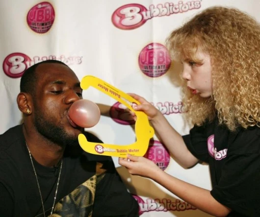 Basketball star LeBron James has been appointed official U.B.B.L. commissioner. That's Lebron showing his prowess and a fan measuring the size of his bubble with a bubble meter.