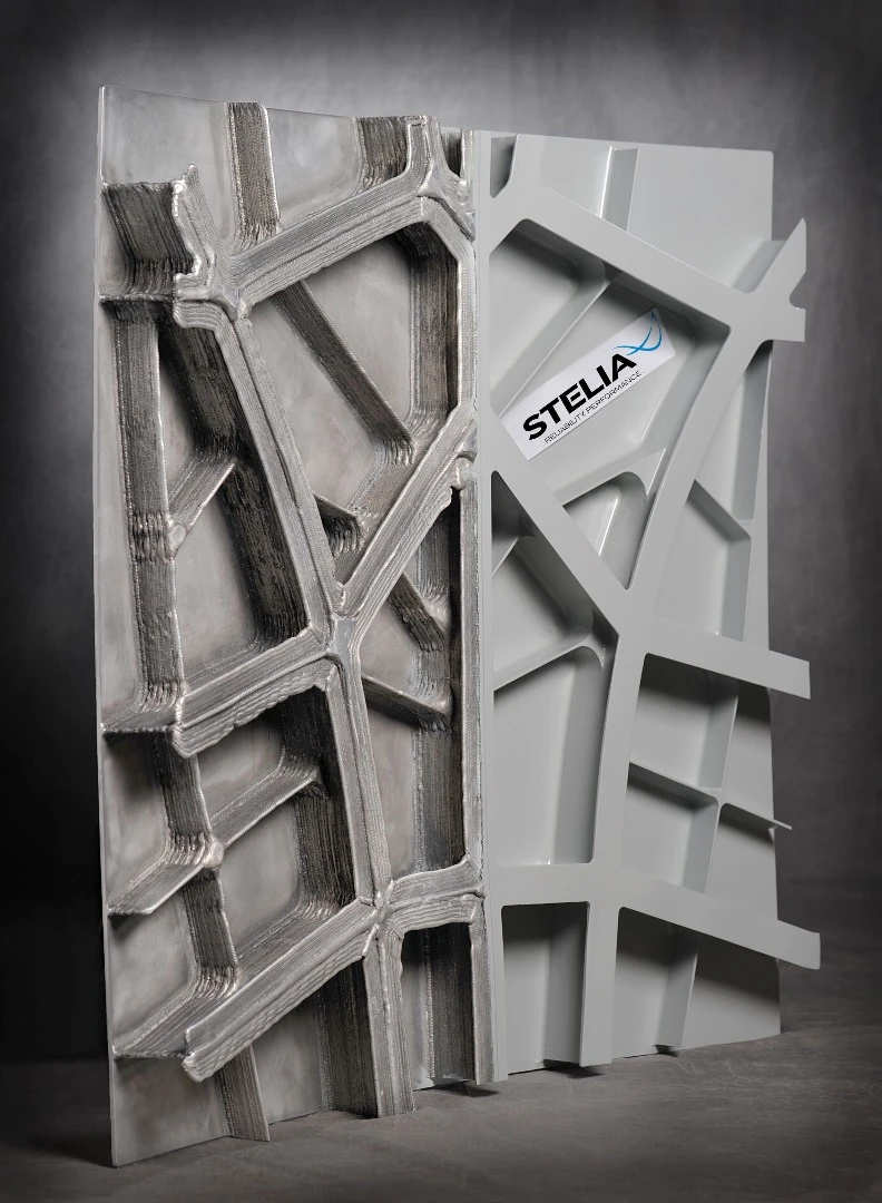 The printed fuselage panel showing the rough printed surface on the left and the polished and painted surface on the right