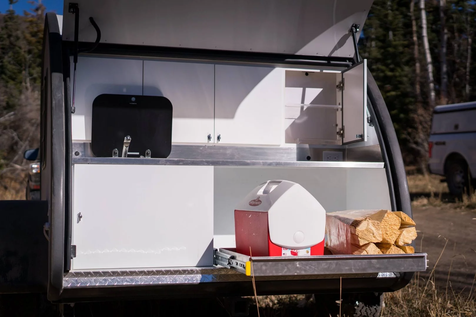 The available slide-out tray can find uses besides housing a large cooler/fridge