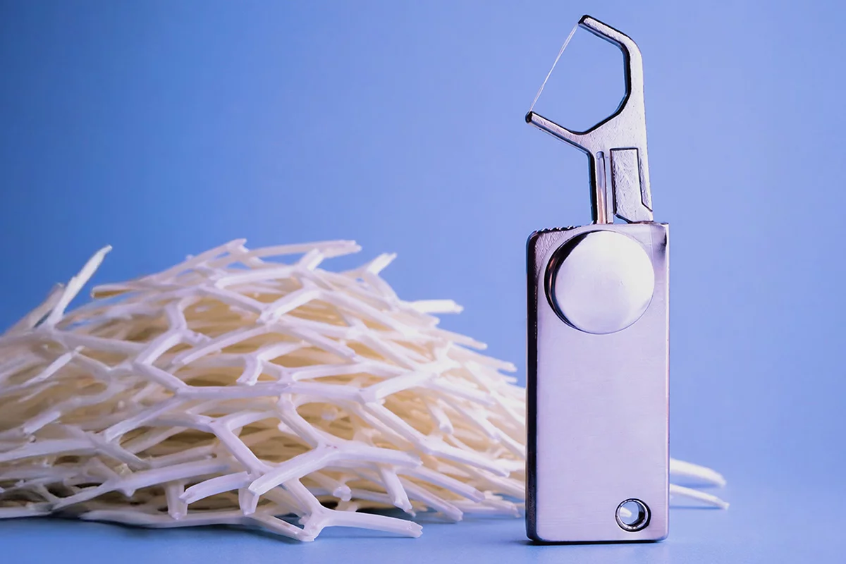 This pocketable little tool neatly holds months' worth of dental floss, and helps you get the job done without getting any plastic involved