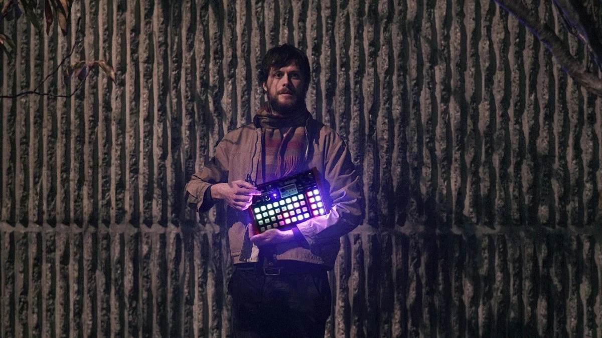 System designer Rohan Hill with the Deluge portable sequencer, synthesizer and sampler