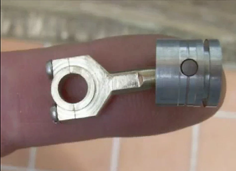 A tiny piston from Patelo's mini-V12 engine