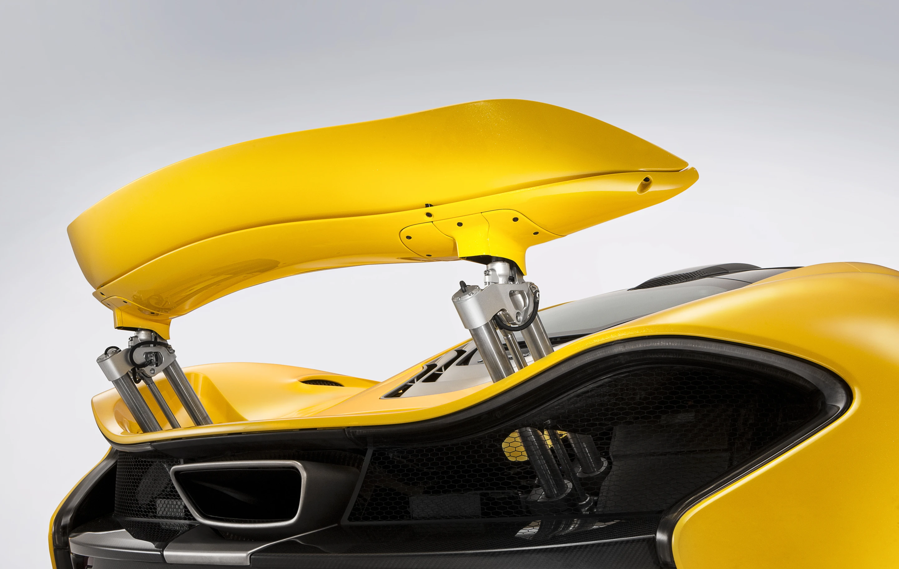 A massive rear wing, hidden in the engine area, pops up at speed to bring about added braking force