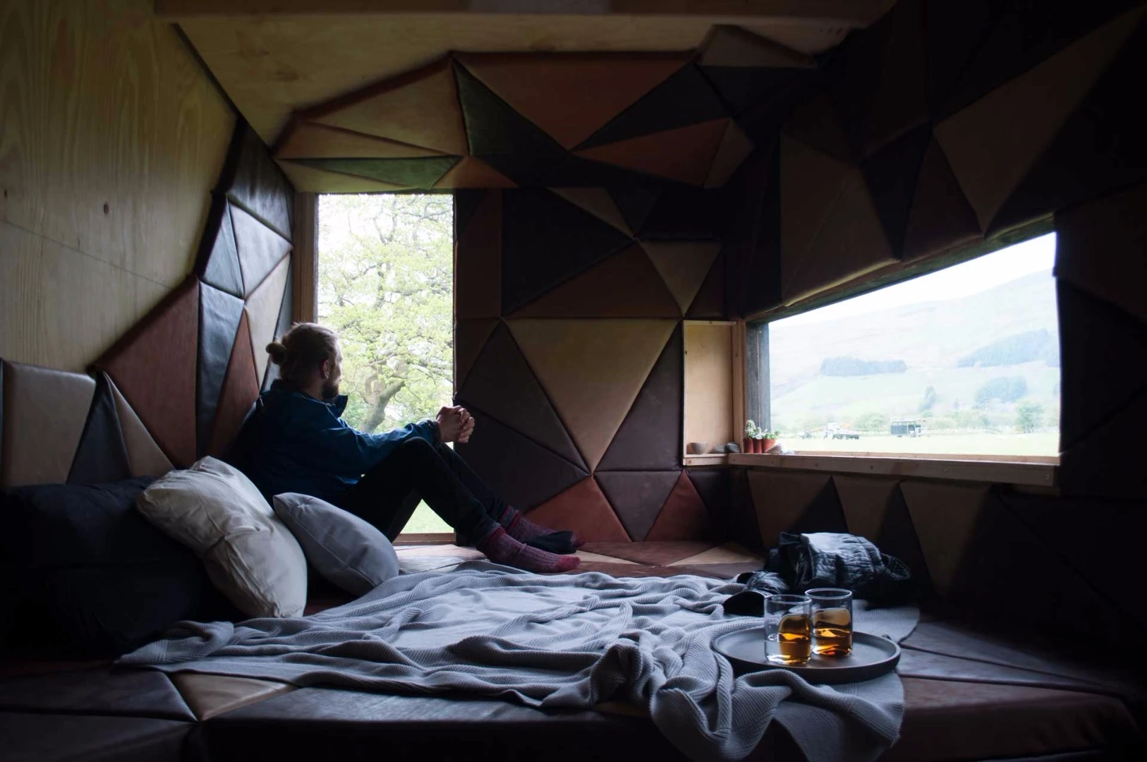 The sleeping area is made up of a bespoke leather cushioned bed and padded wall