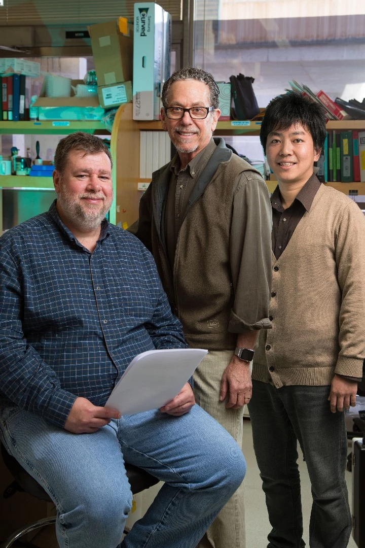 Salk Institute scientists Michael Downes, Ron Evans, and Eiji Yoshihara, who made up the core research team