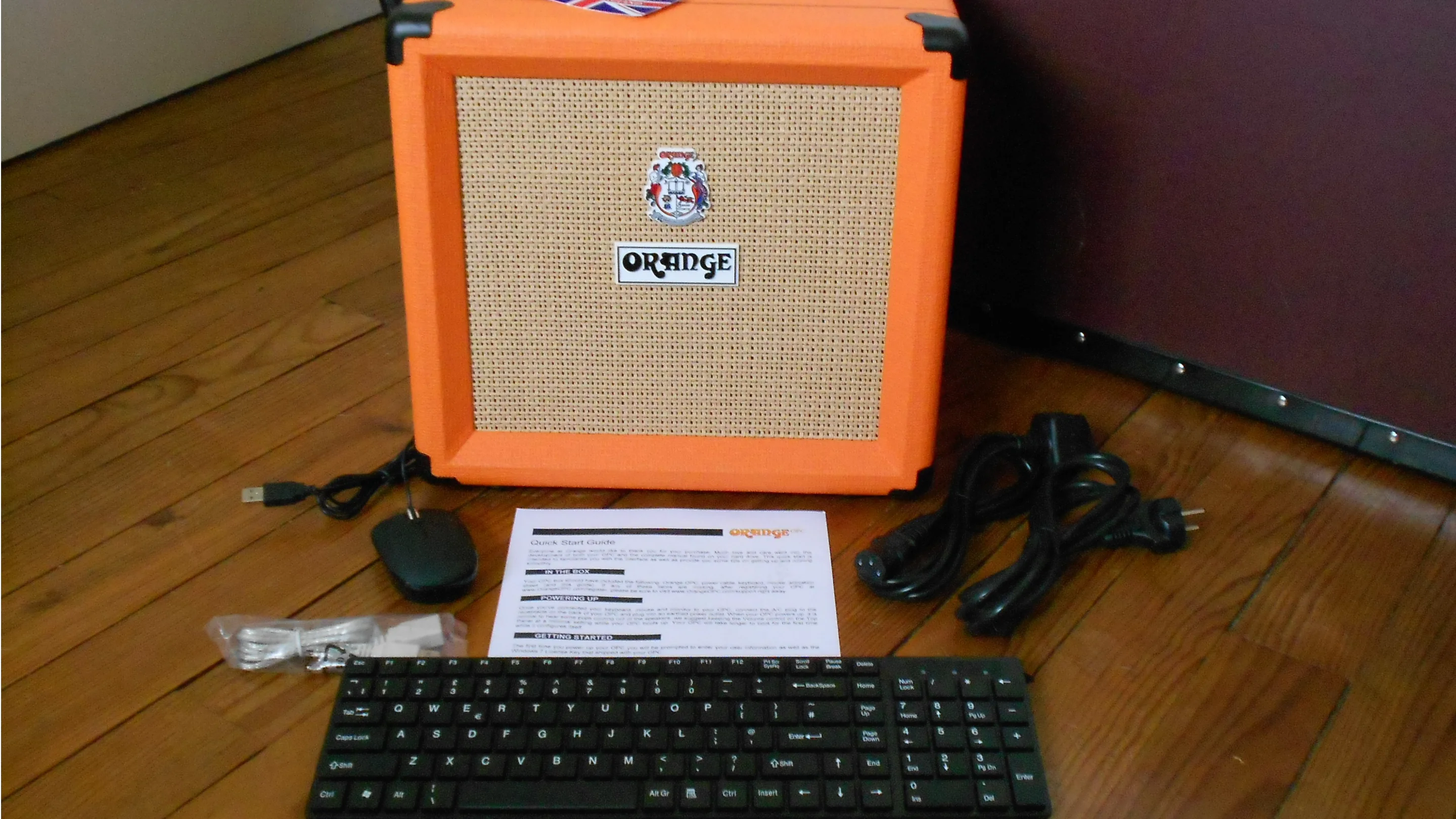 Contents of the box: the OPC, wired keyboard and mouse, power cables, Quick start guide and USB extension cable