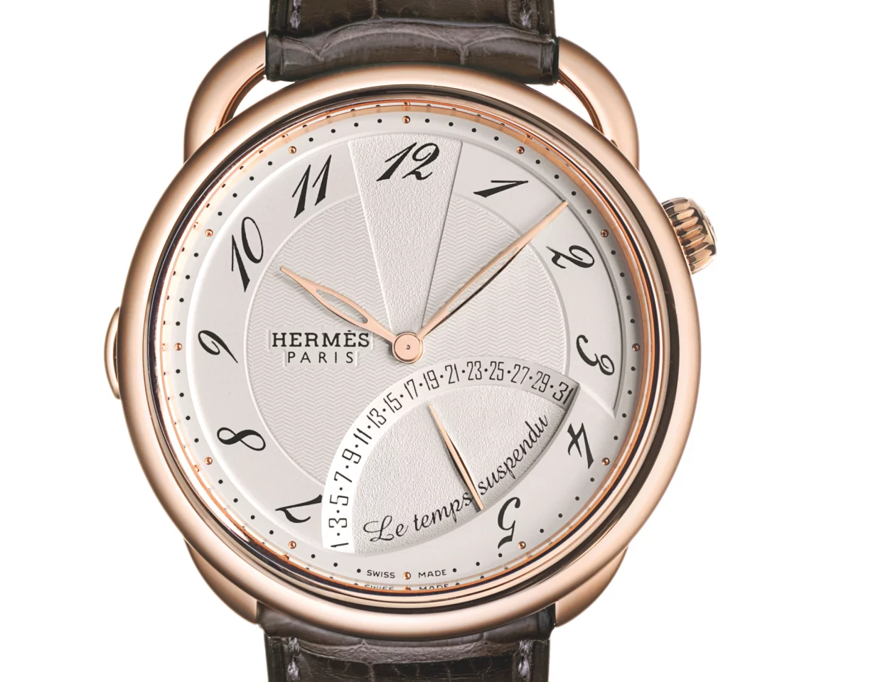 HermÃ¨s' Arceau Le Temps suspendu is an interesting concept, in that the owner can "suspend time" by pressing on the pusher, at which point the sweep of the seconds, minutes and hours are suspended and the date indicator disappears.