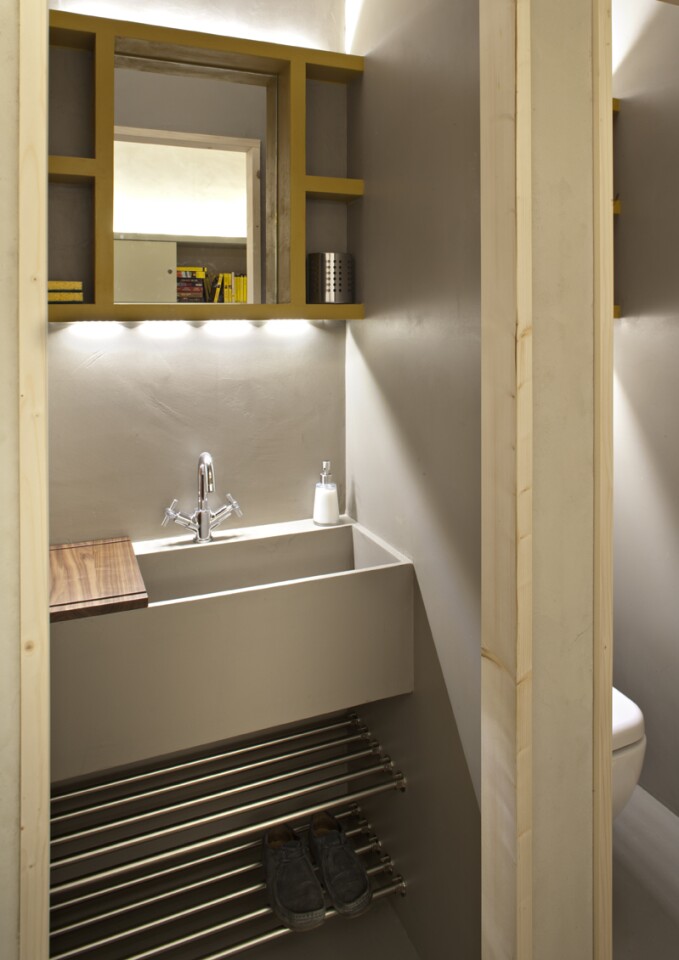 A toilet and shower are included in the small space