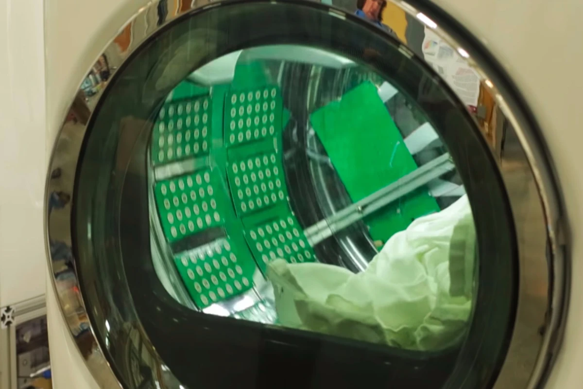 In a step towards commercial availability, ORNL researchers have integrated their ultrasonic drying technology into a clothes dryer drum