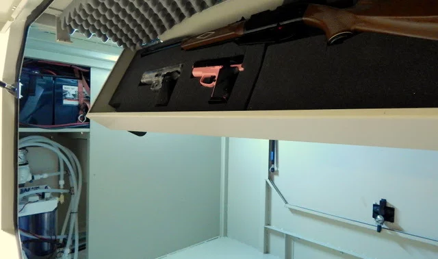 The gun box option stores firearms in a drop-down locker mounted to the ceiling