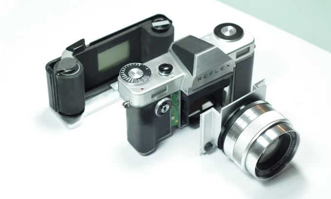The Reflex camera features a removable film back and interchangeable lens mounts