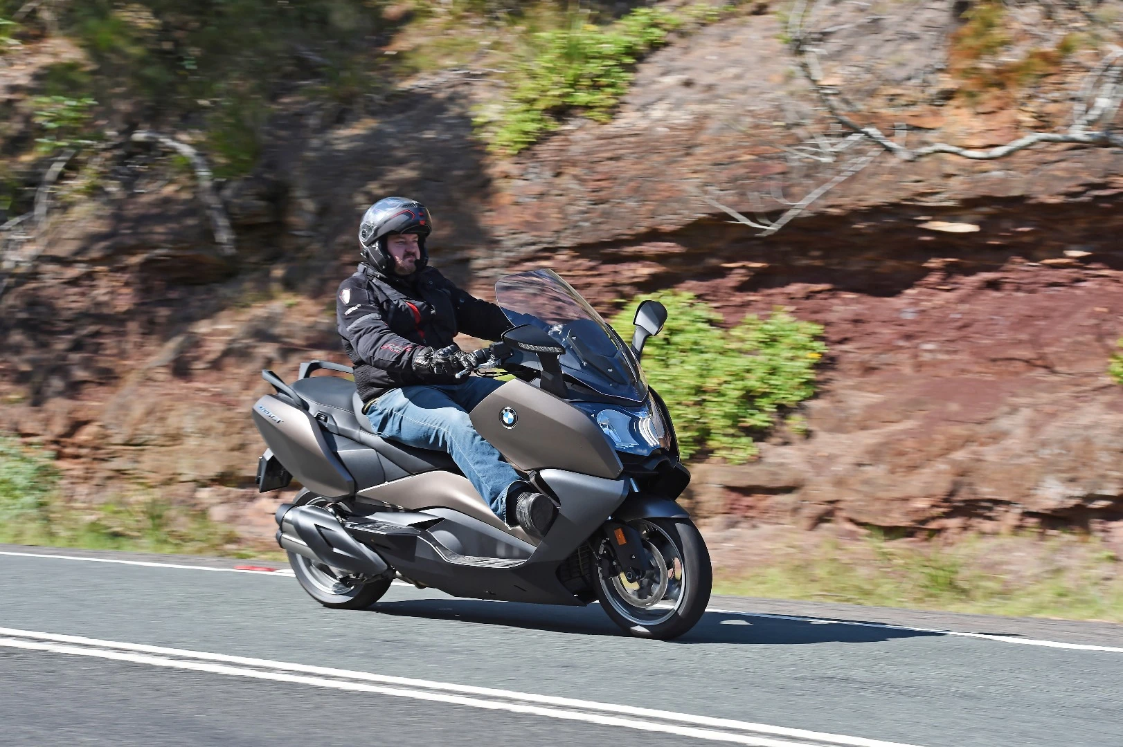 BMW's C650 GT: large rider and passenger footboards give you plenty of seating options, including this one, which I call "virtual highway pegs"