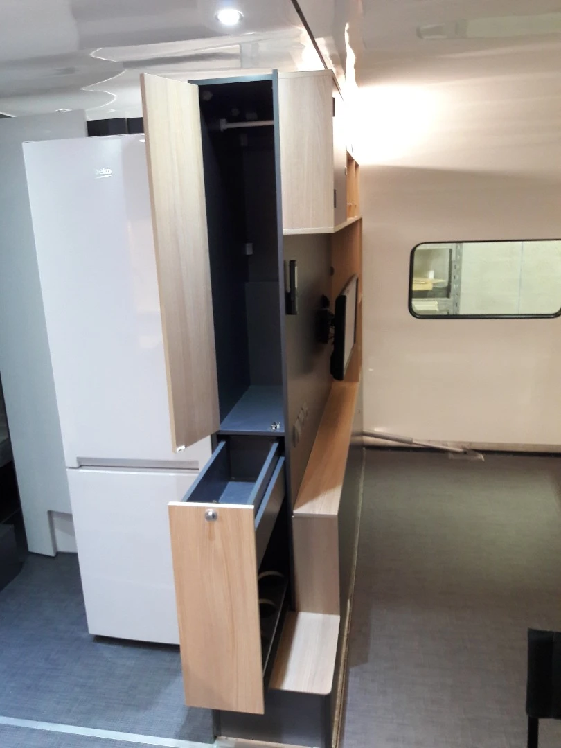 The living room entertainment center is also a storage unit