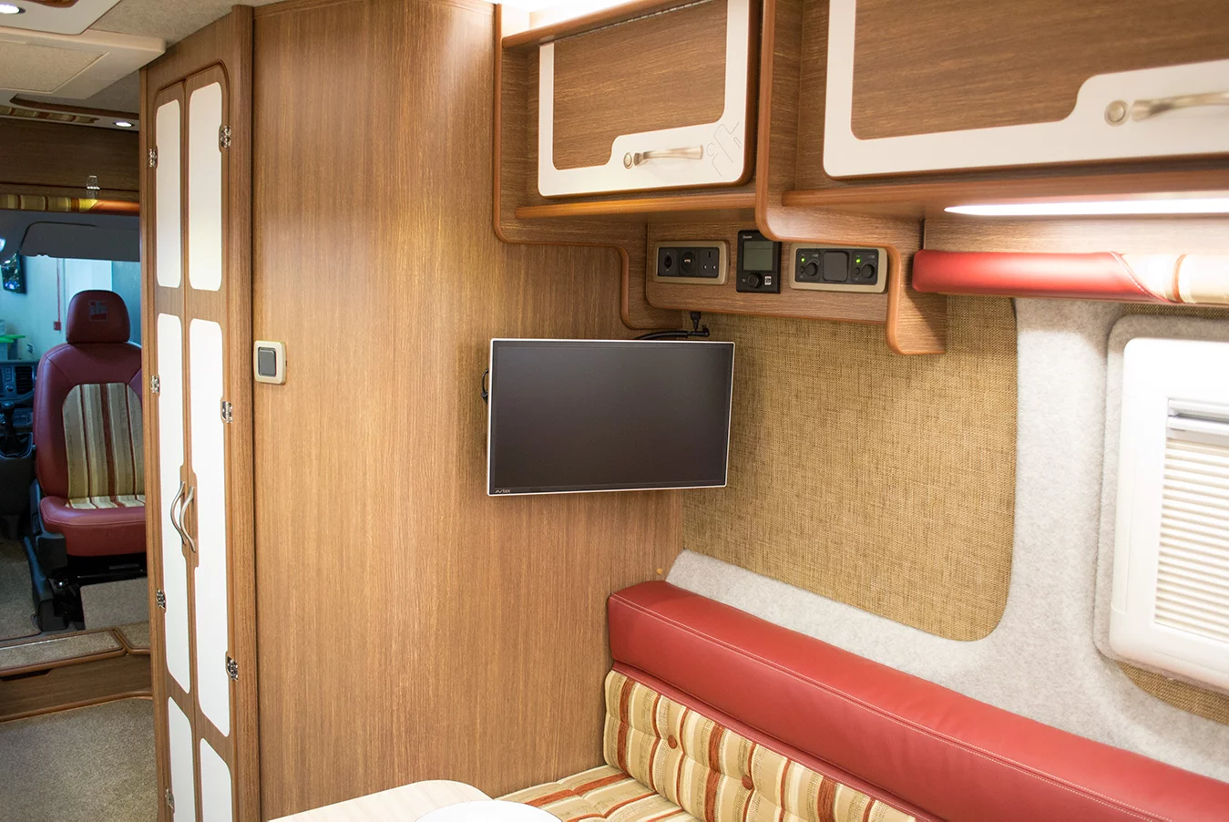 TV and digital controls just fore of the rear lounge