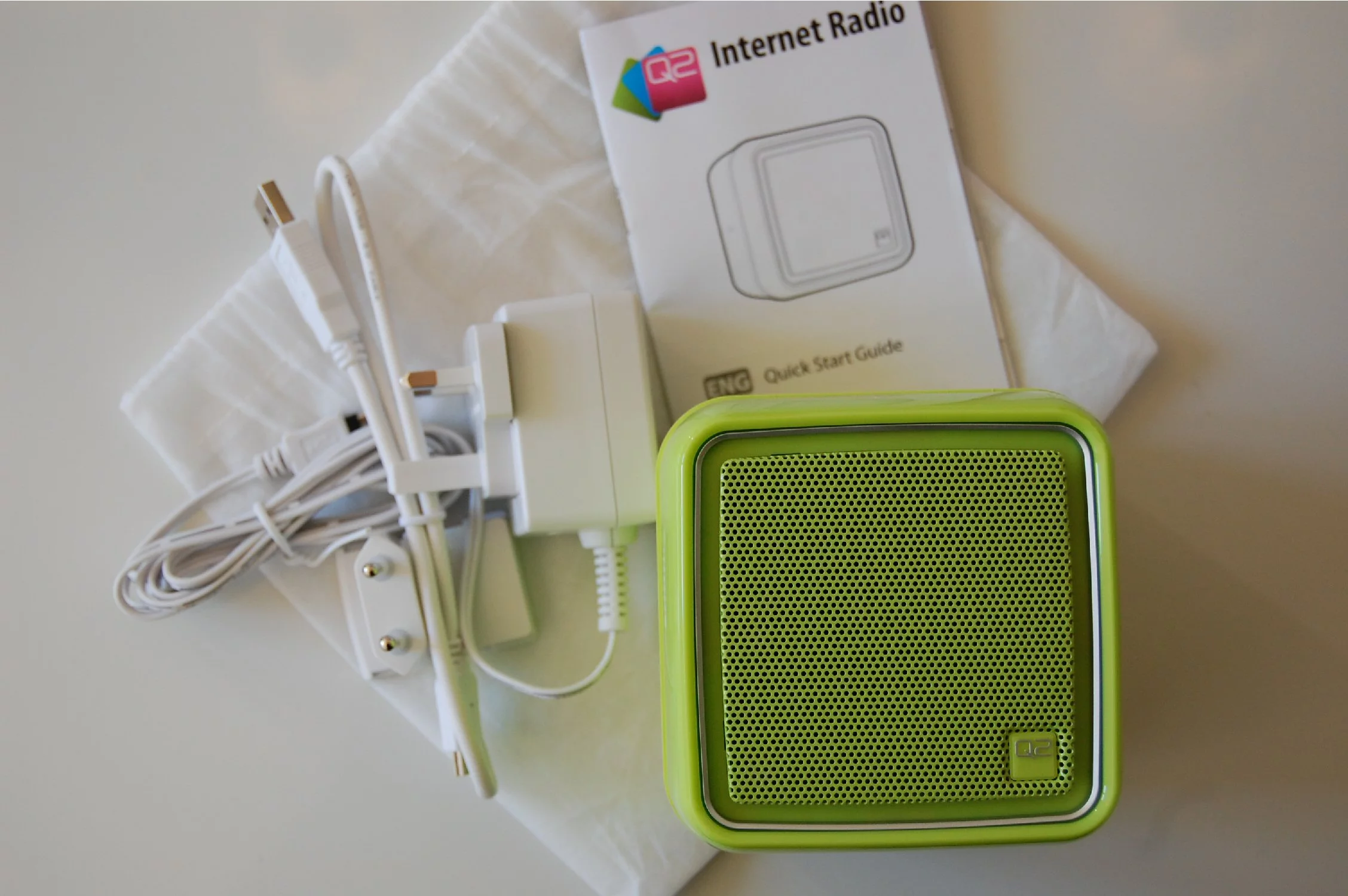 The box contents: the Q2 Internet Radio; printed instructions; a USB to mini-USB cable; and a charger
