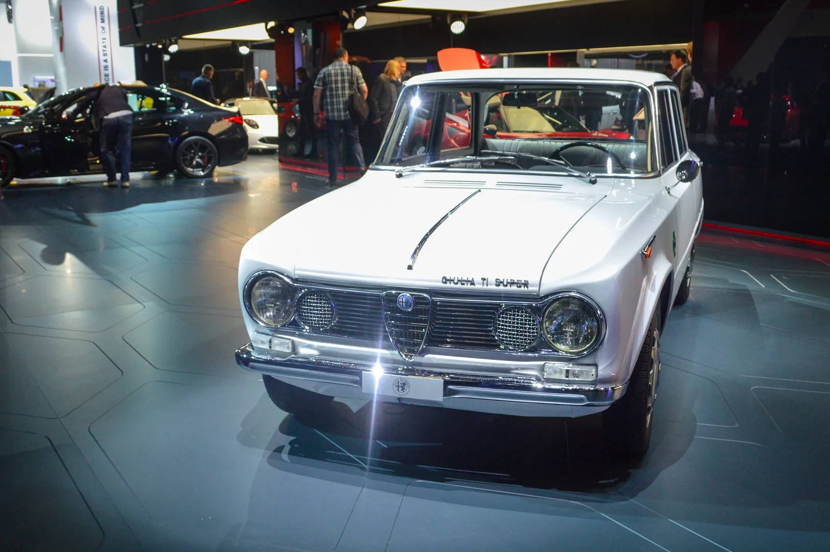 A classic Alfa Romeo Giulia helps welcome the all-new Giulia