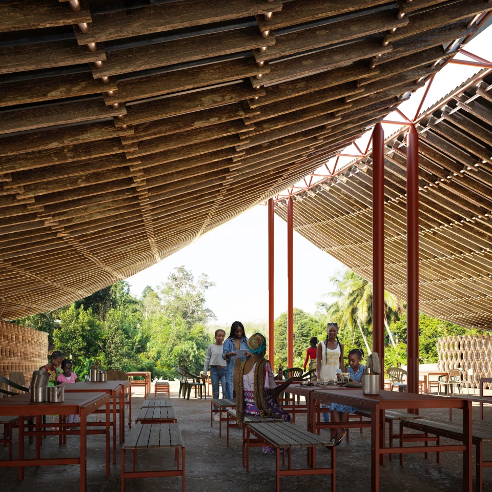The community center's interior is designed to offer an open, flexible floorplan that suits the local climate