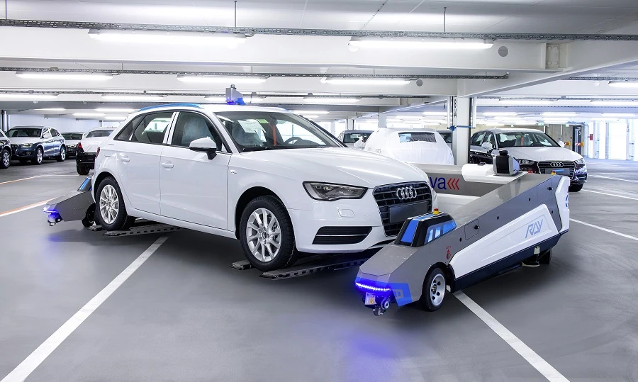 Audi is piloting autonomous robots in its Ingolstadt plant to move cars out of the way until they're needed