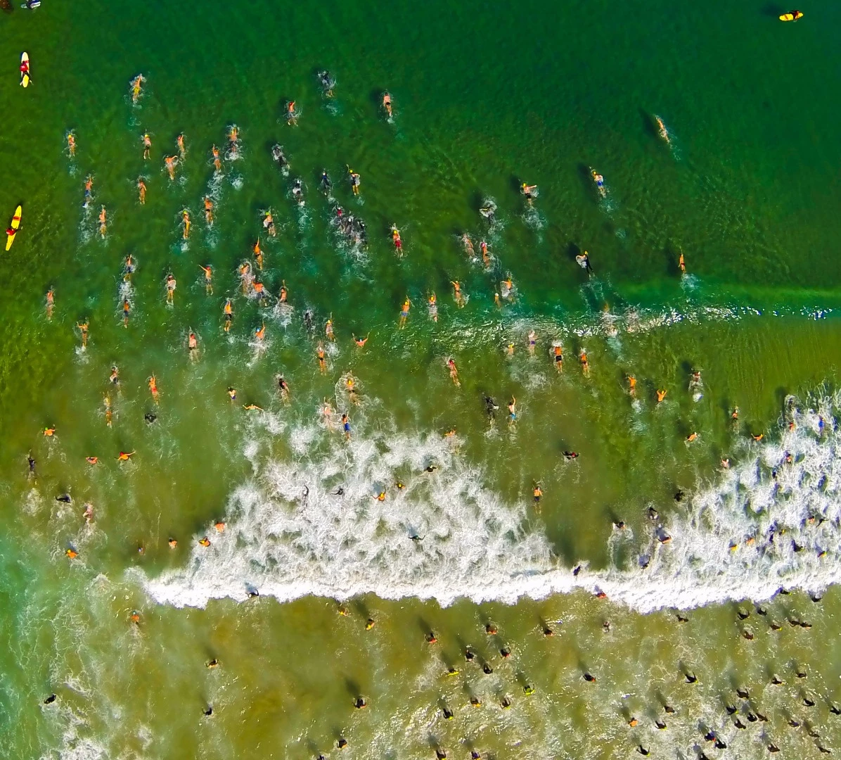 This aerial photo of people taking to the water in La Jolla, San Diego's Pier-To-Cove ocean race won second place in the Nature category