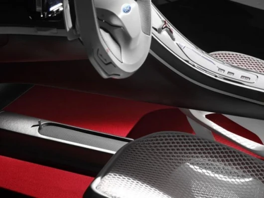 The white mesh fabric is offset with warm red carpeting.
