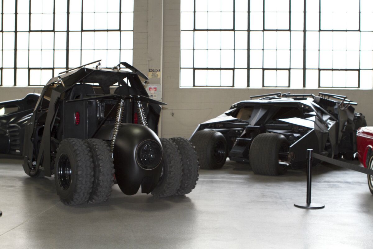 The Tumbler golf cart with a full-sized Tumbler in background