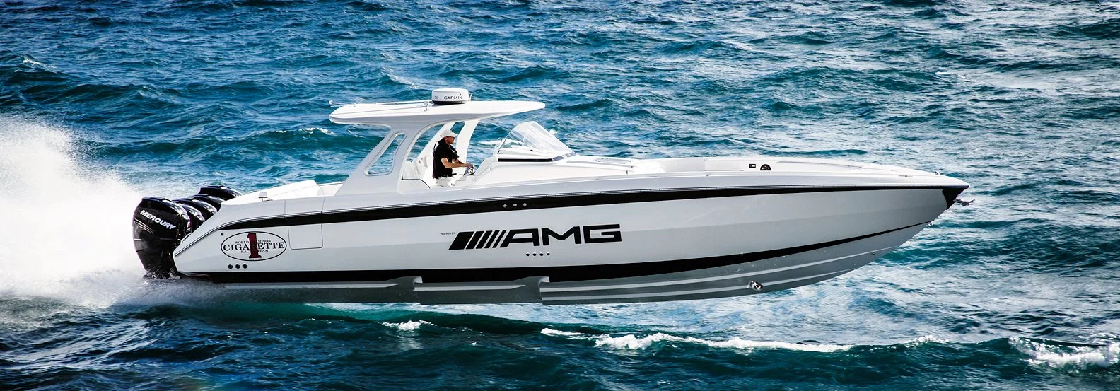 The Cigarette Racing/AMG Huntress planing through the water. Note the side entry door