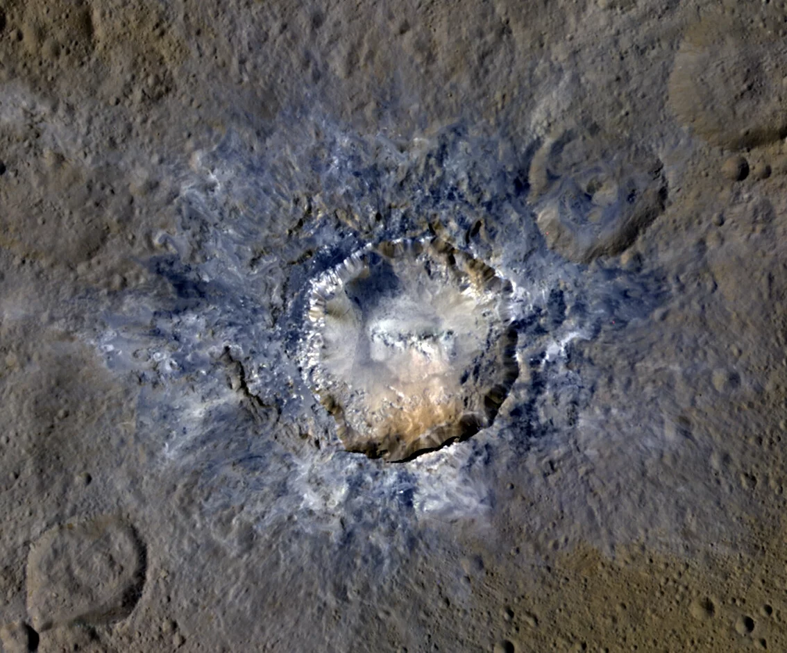 Bright debris surrounding the 21-mile-wide (34 km) Haulani Crater on Ceres