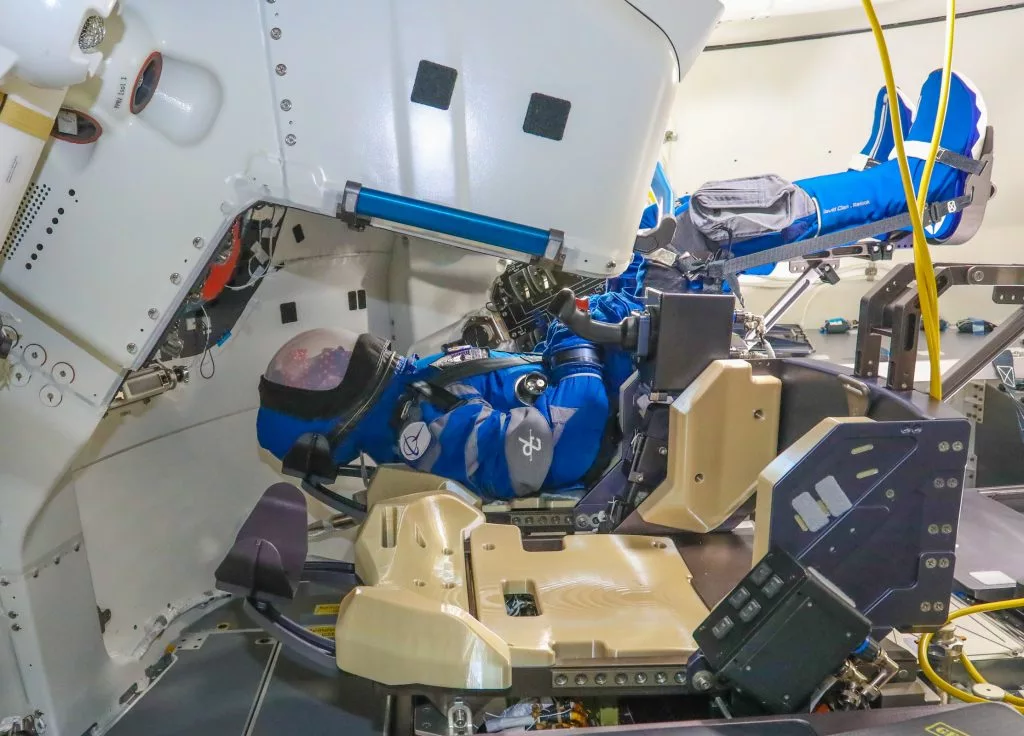 A dummy called Rosie the Rocketeer sits in the commander's seat of the Boeing Starliner capsule