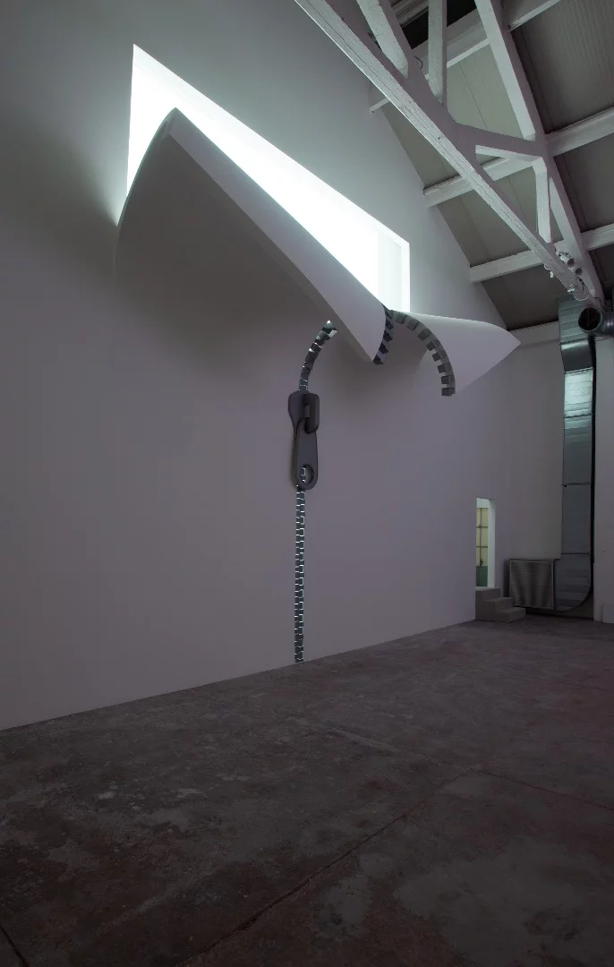 The interior of IQOS World features another two zip installations