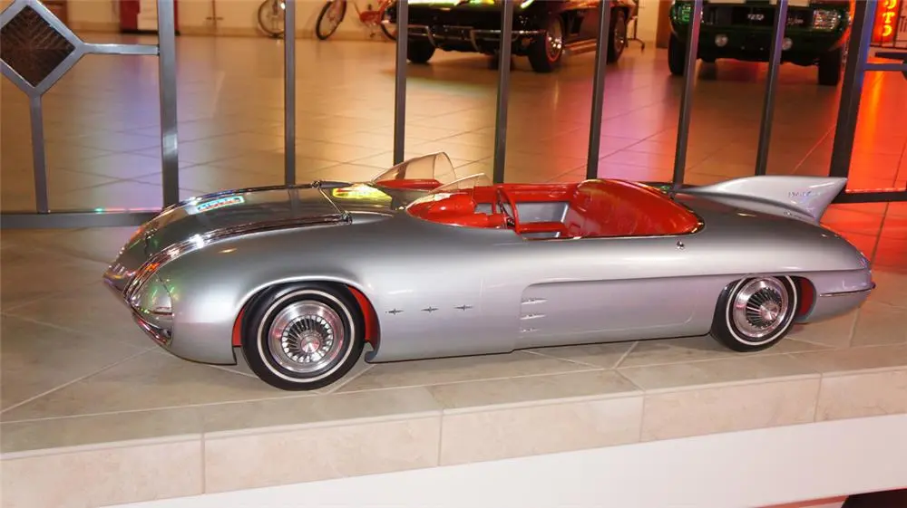 Originally constructed as a 3/8 scale model for display next to the full size car at General Motors' Motoramas, the car was destined for destruction until GM designer Harley Earl liberated the model and had it converted into an electric car for his grandchildren to play with. It is the only surviving remnant of GM's Club de Mer design. It sold for $33,925.