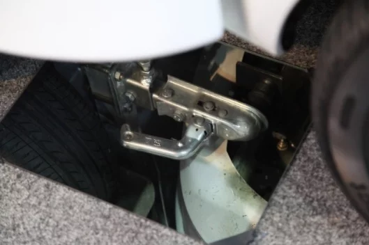 The "sideways" towbars used to connect the housing unit to the car
