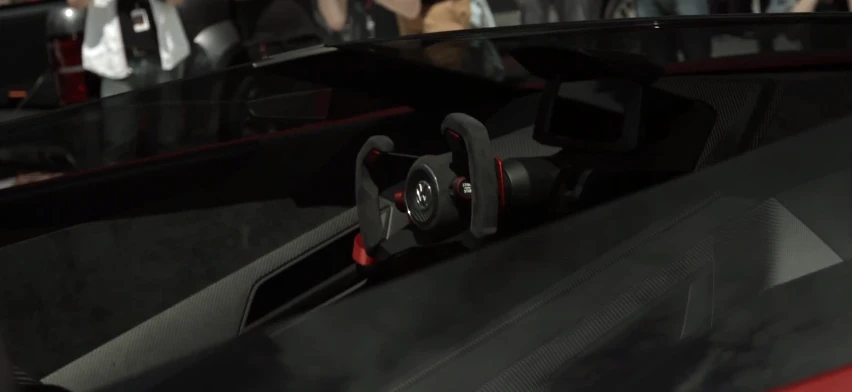 The driver is seated in a highly race-influenced cockpit