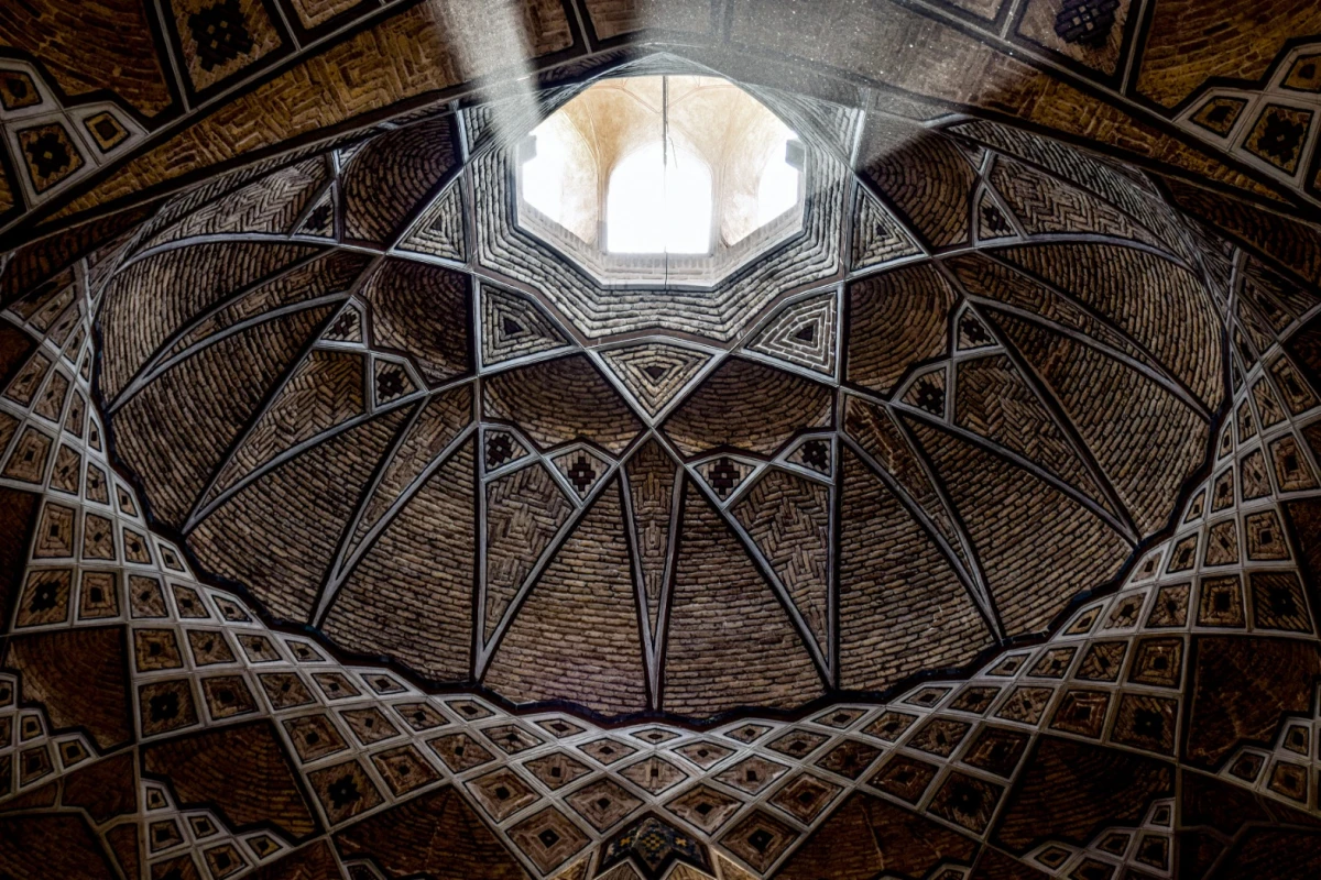 The intricate ceiling of a carpet market in Iran