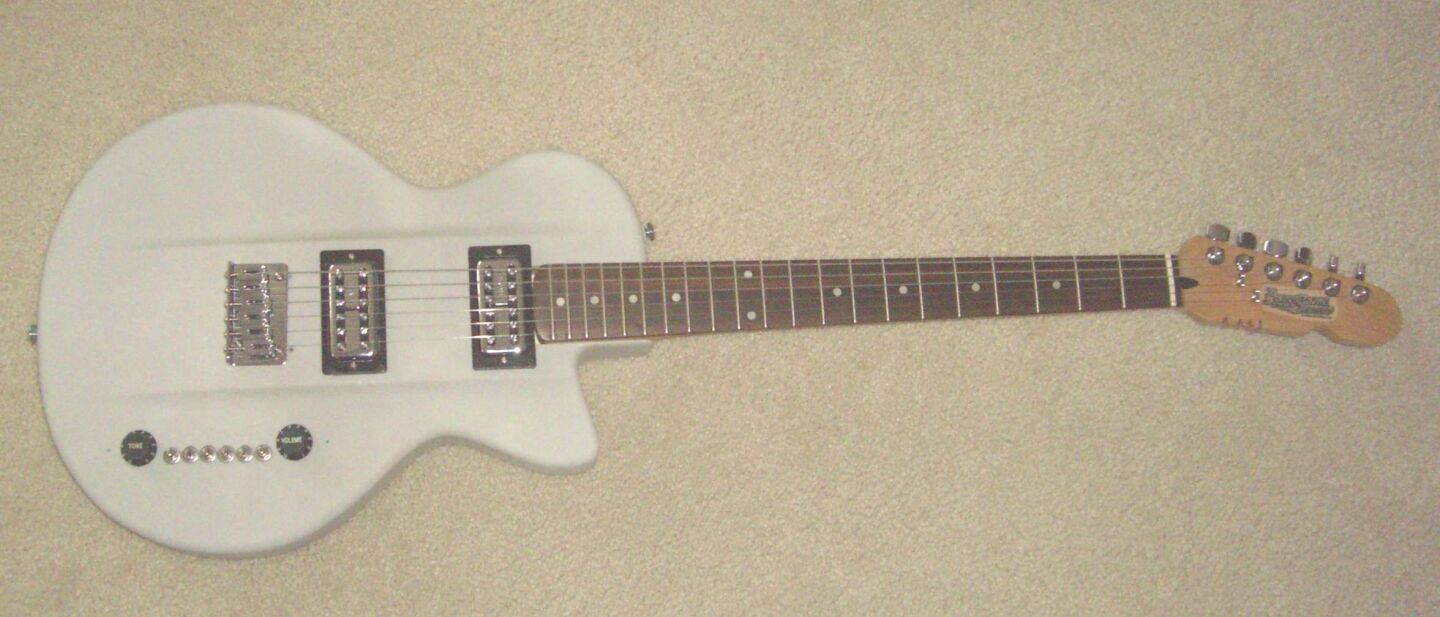 The AWE-3DG features a 25.5-inch scale maple neck with a 21-fret rosewood fingerboard, T.V. Jones PowerTron humbucker pickups, and something called the T4-Switch