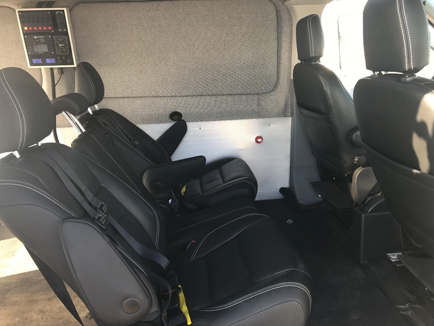 The rear seats can be mounted in "transit mode," just like standard van seats