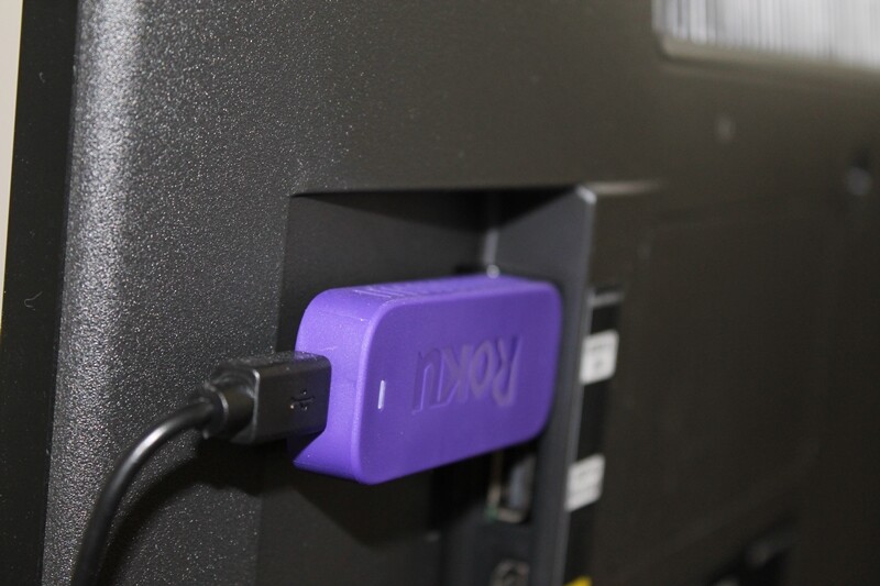 The Streaming Stick slots into a HDMI port on a TV, while the power cable slots into the Streaming Stick and is connected to a plug socket or USB port for power