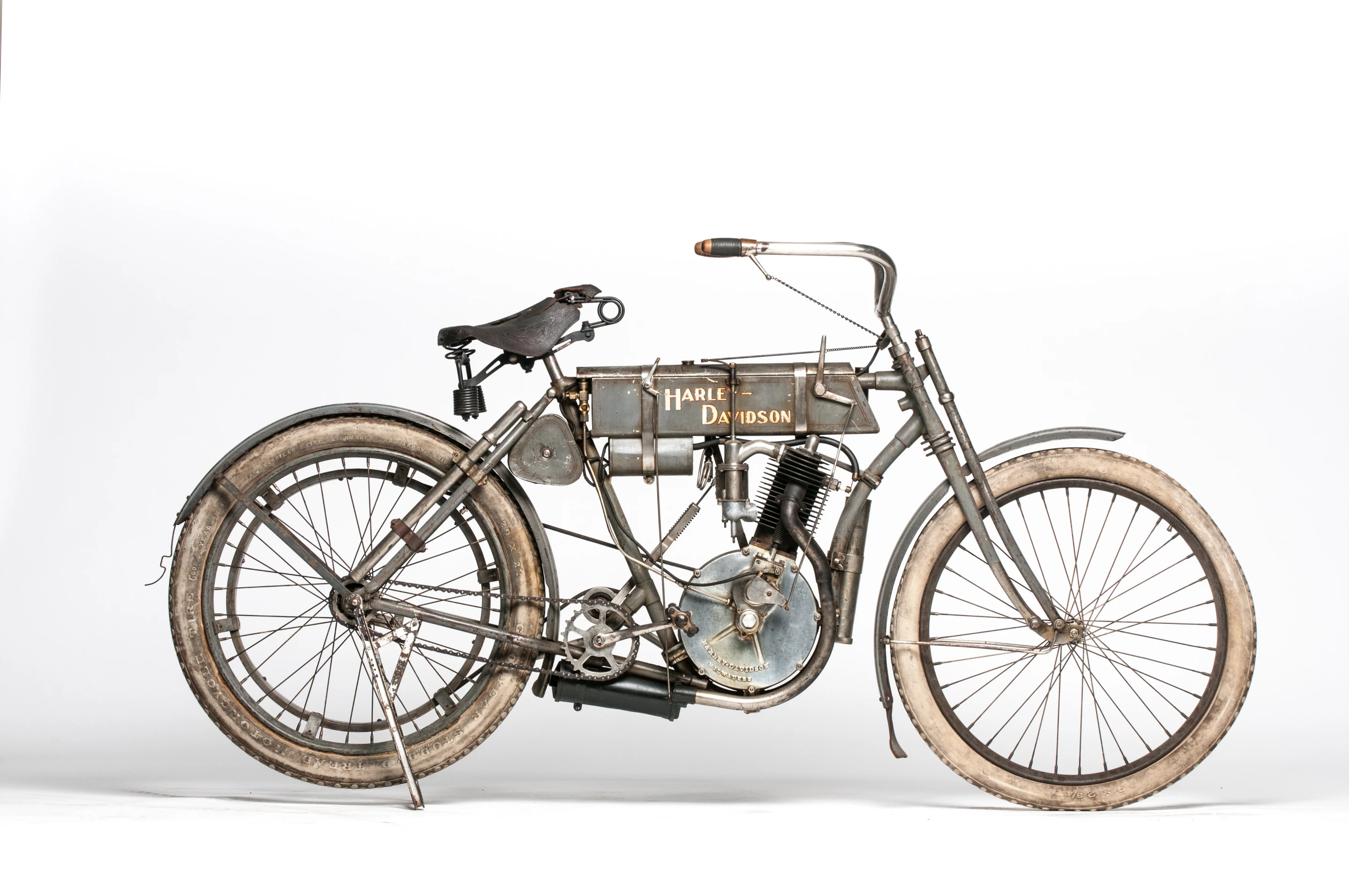 The highest estimated price of all the bikes in the Cole Collection has been placed on this 1907 Harley-Davidson Strap Tank. This bike is one of the first 100 Harley-Davidsons ever built. Its serial number suggests it was the 37th bike made in 1907, making it the 94th bike overall, including the original two prototypes. Strap tank single Harleys are rare, but the striking aspect of this bike is its originality.