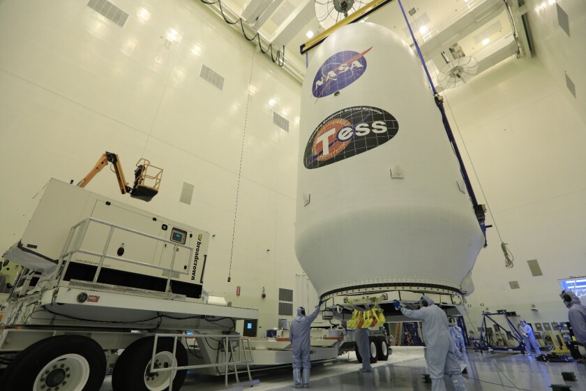 TESS in its nose cone awaits mating with the Falcon 9 rocket